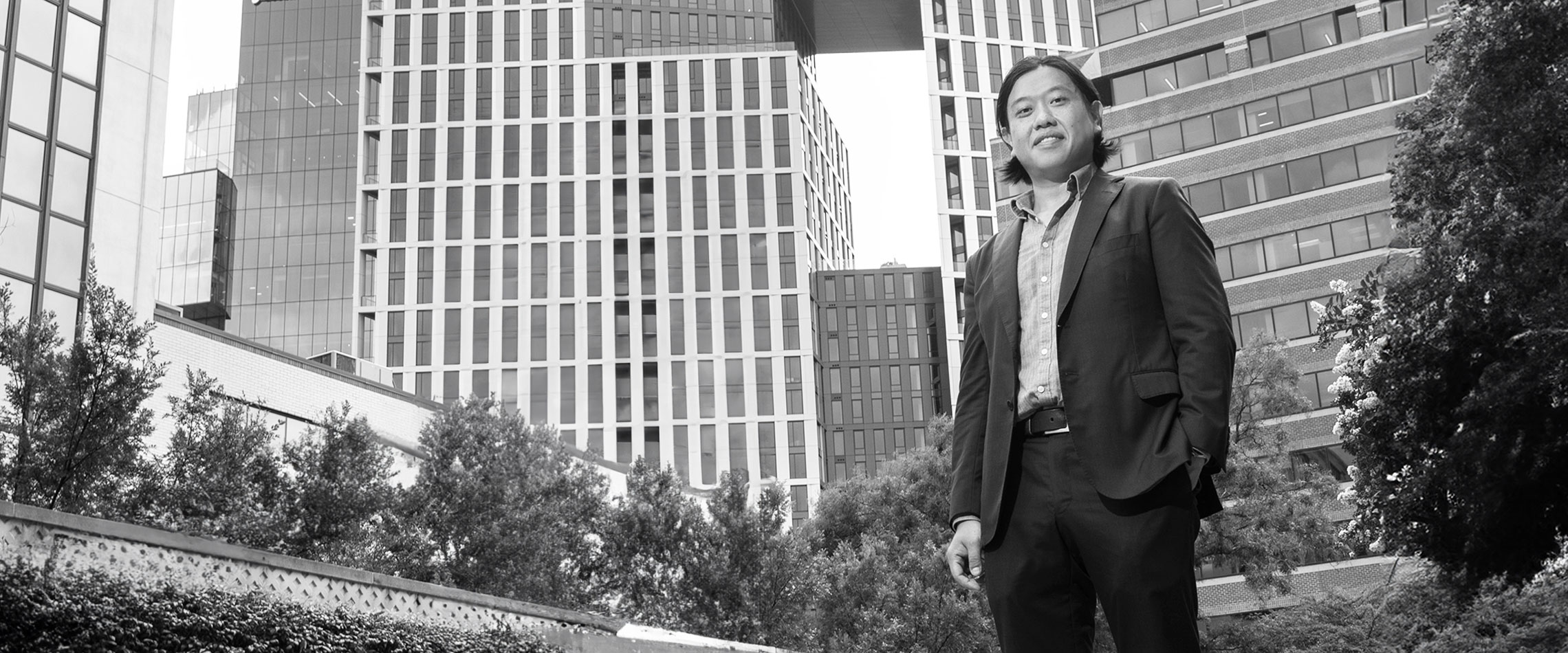 Daniel Wang, Director, Cannabinoids and New Dietary Ingredients standing outside in an urban environment.